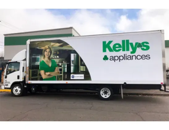 dad and son in front of an open dishwasher